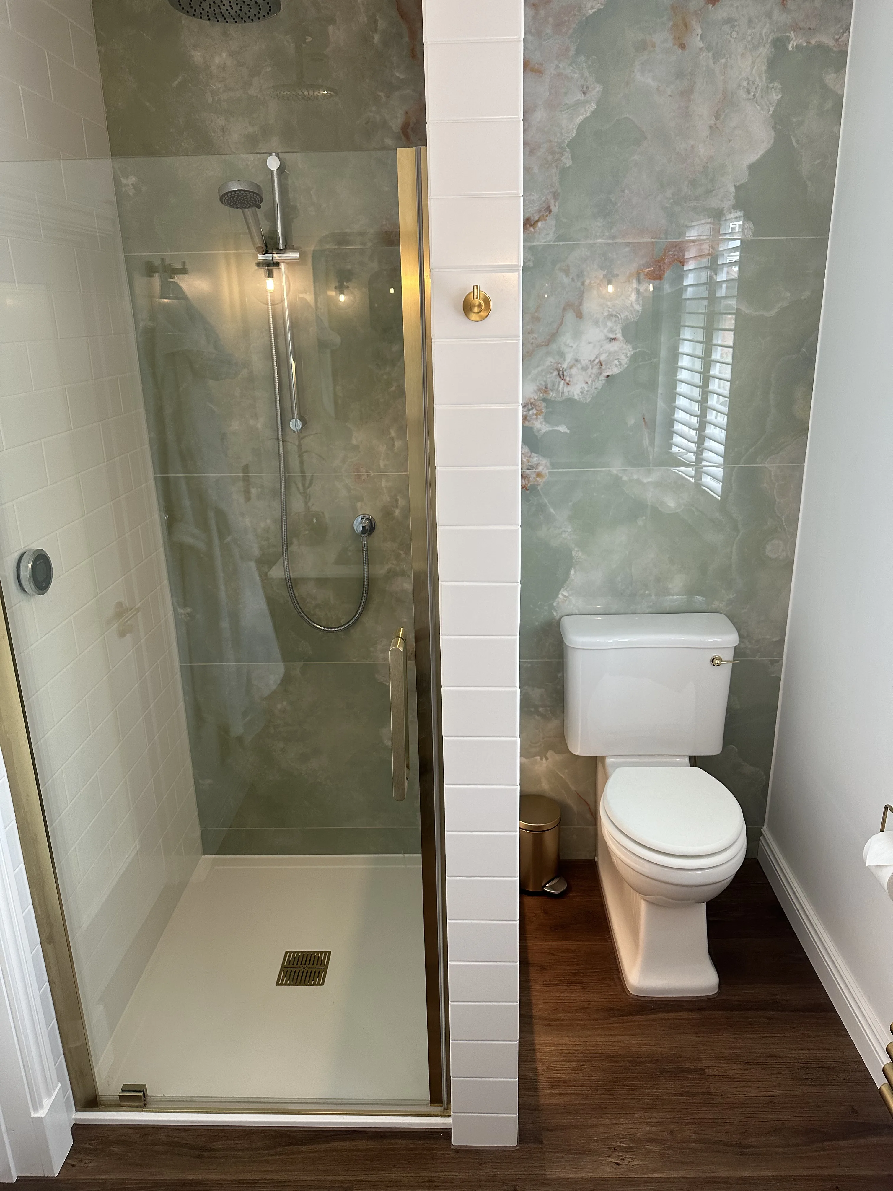 Walk-in shower enclosure with tiled finish