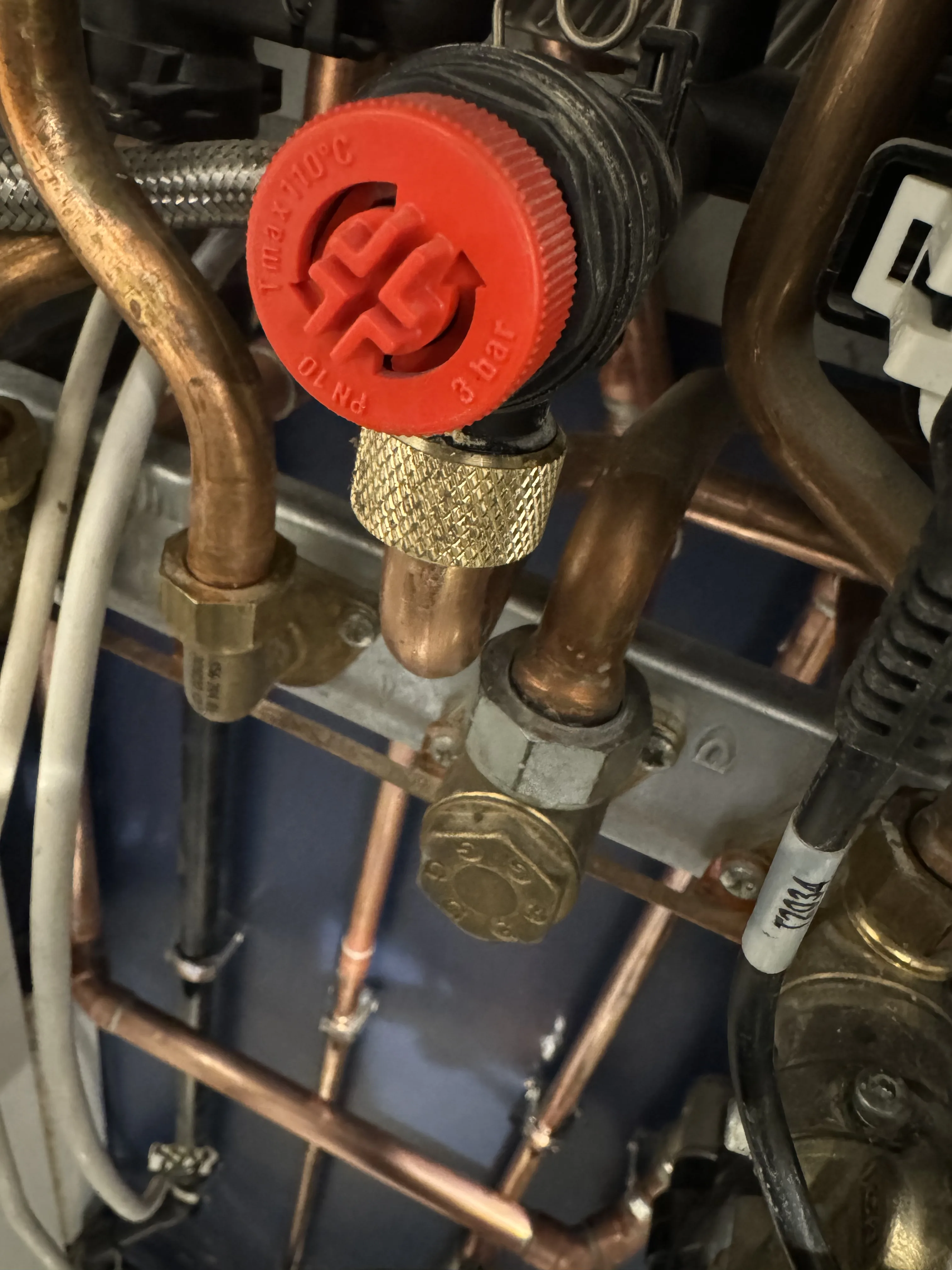 Close-up diagnostic check on boiler valves and pipework