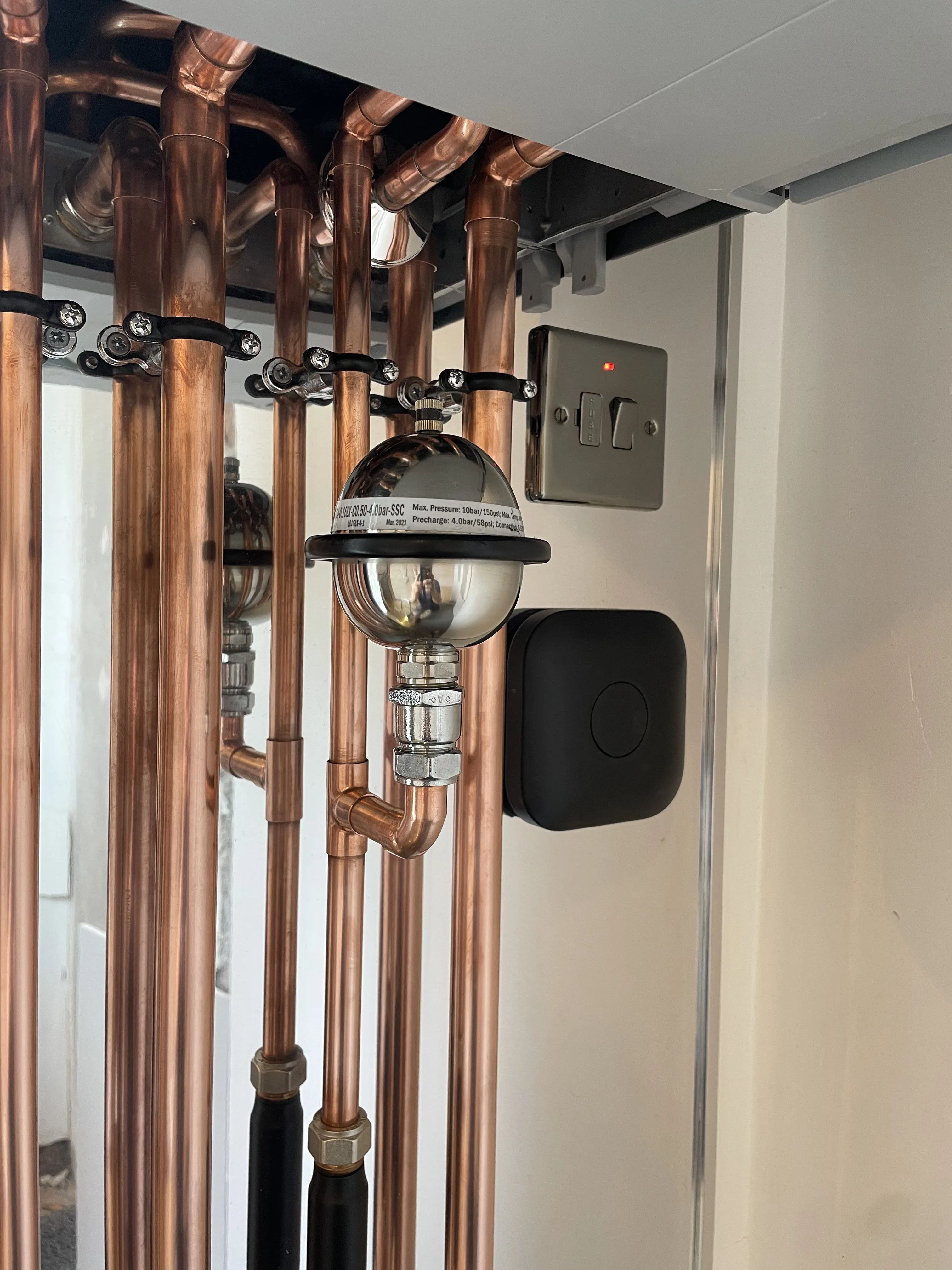Bespoke boiler install with feature background and custom front
